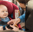 75968471 - father fasten his little baby in the car seat - Газета Восход